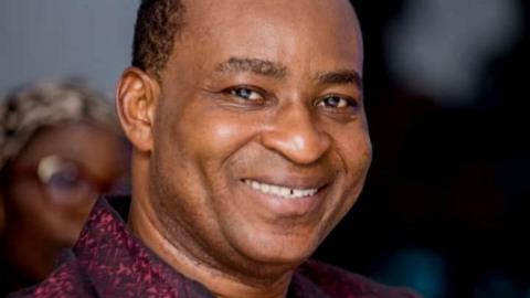 Bernard Antwi Boasiako smiles at the camera in a close up shot.
