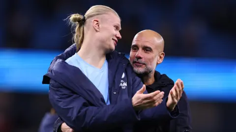 Pep Guardiola and Erling Haaland