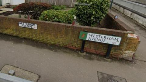 A street sign for Westerham Avenue is seen next to the wall of a front garden.