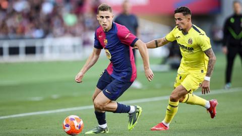 Fermin Lopez dribbles the ball
