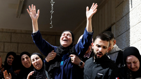 A mourner reacts during the funeral of three Palestinians killed during an attack by Israeli settlers in the village of Abu Falah, near Ramallah, in the Israeli-occupied West Bank (9 March 2026)