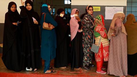 Women voters stand in queues to cast their votes at a polling station during the Kerala state assembly election in Kochi, India, on April 9, 2026. (Photo by Sivaram Venkitasubramanian/NurPhoto via Getty Images)