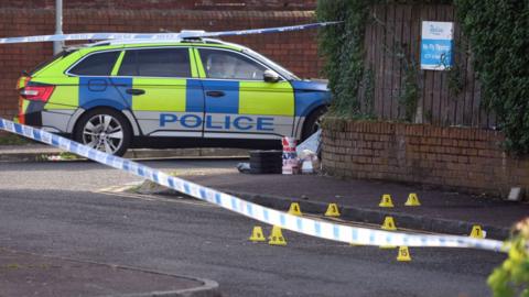 A police car sitting at a crime scene