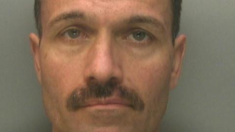 A custody image of Darren Hanson.