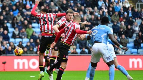 Coventry City defender Bobby Thomas heads his 80th-minute equaliser against Sheffield United at the CBS Arena