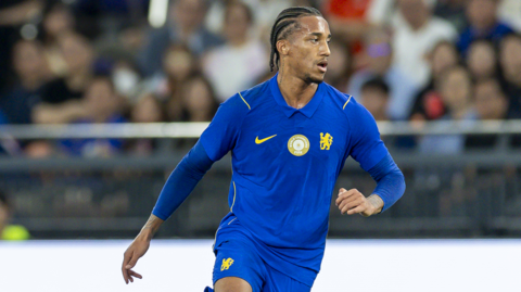 Chelsea's Joao Pedro in a blue home kit