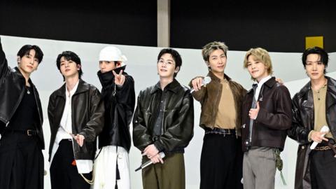 BTS pose together after their performance on The Tonight Show