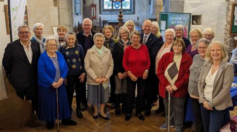 Choir of 19 people with the Lieutenant Governor of Jersey