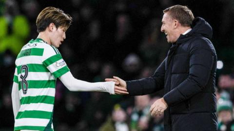 Kyogo low fives Brendan Rodgers