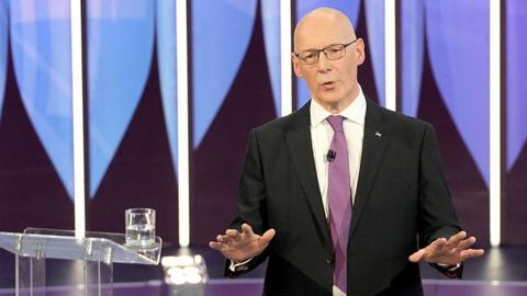 SNP's John Swinney gestures as he speaks during Question Time special on 20 June