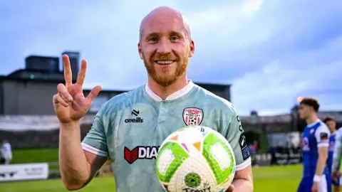 Derry City hat-trick hero Liam Boyce celebrates with the match ball