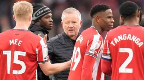 Sheffield United boss Chris Wilder congratulates his players after their win over Watford