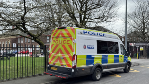 Police van parked outside the school gates