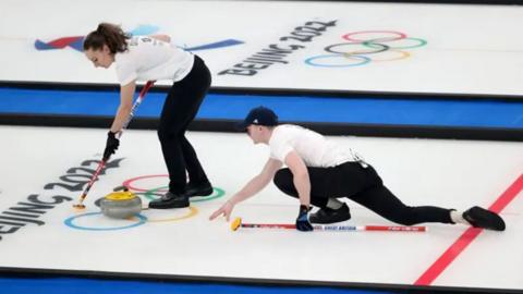 Long-established British curling pair Bruce Mouat and Jen Dodds are on the ice.