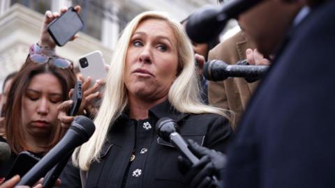 Marjorie Taylor Greene speaks to reporters outside the US Capitol in March