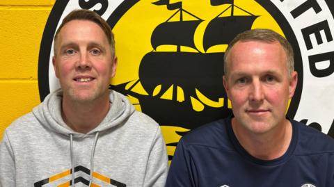 Sam and Shaun Graham are sitting in the changing room at Boston United.