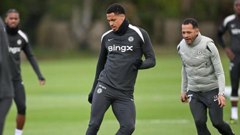 Levi Colwill training, with Liam Rosenior in the background