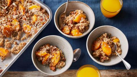 Baked oats with peaches, almonds and desiccated coconut 