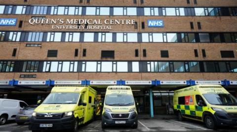 The Queen's Medical Centre front view with ambulances in front of it