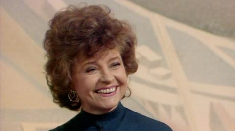 Actress Prunella Scales smiling in the Wogan television studio in 1991.