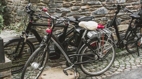 A stock image of three electric bikes.