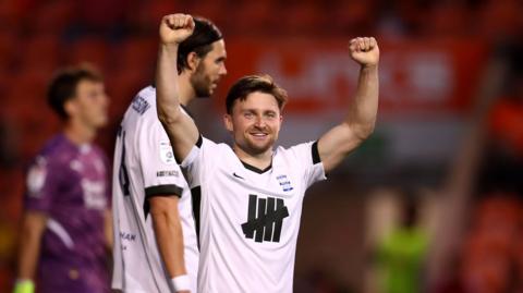 Alfie May celebrates