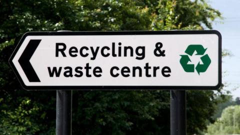 A stock image of a sign for a recycling centre.