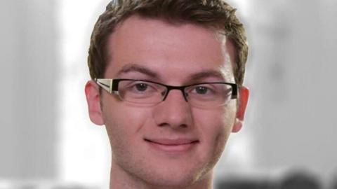 Stephen Sutton. He has short hair and square glasses. He is smiling and looking at the camera. 