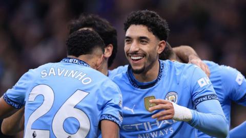 Omar Marmoush (R) celebrates with Savinho (L)
