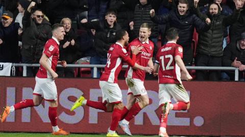 Bristol City players celebrate with goalscorer Rob Atkinson