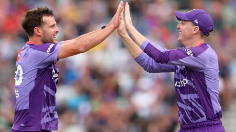 Tom Lawes (left) of Northern Superchargers celebrates with team-mate Harry Brook (right) after taking the wicket of Jordan Cox