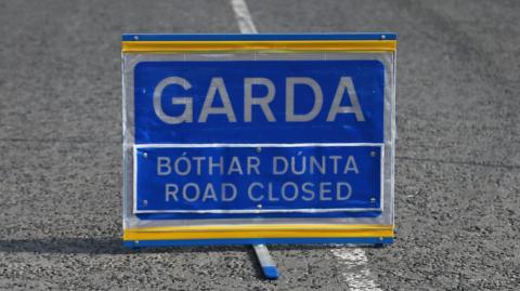 Garda sign in blue and white and yellow.
