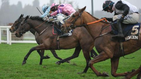 Beauport, Crambo and HiddenValley Lake race to the line at the Long Walk Hurdles at Ascot 