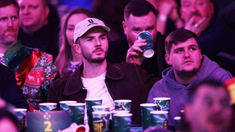 James Maddison watching darts