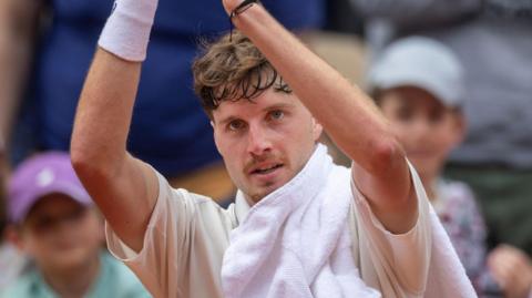 Great Britain's Toby Samuel applauds the crowd after beating David Goffin in French Open qualifying
