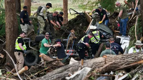 Search and rescue teams work in central Texas after deadly floods