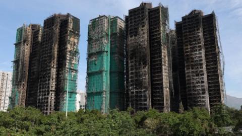 The charred buildings of Wang Fuk Court housing complex following a deadly fire, in Tai Po, Hong Kong, China, November 28, 2025.