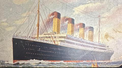 1912 postcard shows an artist's illustration of the Titanic at sea -  complete with smoke coming out of all four funnels.