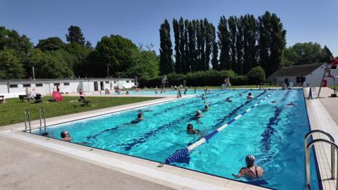 Swimmers enjoying Abingdon's Abbey Meadows Outdoor Pool