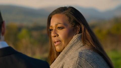 Alison Hammond sitting outside speaking with Jimmy Carr