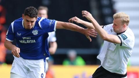 Yousuf Salech holds off a Derby County defender