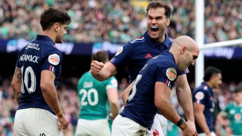 Damian Penaud of France celebrates after teammate Louis Bielle-Biarrey (not pictured) scores the team's third try during the Guinness Six Nations 2025 match between Ireland and France at the Aviva Stadium on March 08, 2025 in Dublin, Ireland