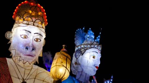 Lanterns of Hindu gods. On the left there is Lord Hanuman, who is the monkey god and on the right there is Lord Ram, who is wearing a crown on his head.
