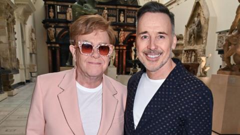 Elton John and David Furnish at the V&A