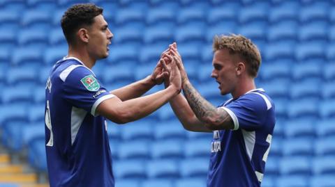 Yousef Salech of Cardiff City, left, celebrates after scoring goal with Isaak Davies of Cardiff City