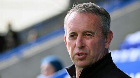Steve McNamara looks on during a Warrington Wolves game