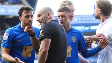 Referee speaks to Birmingham players