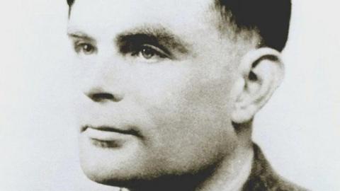 Black and white photo of Alan Turing 