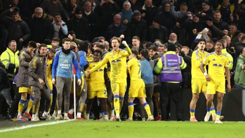 Leeds players and fans celebrate going ahead against Sheffield United