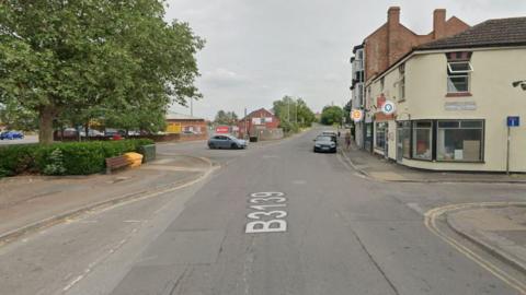 An image taken from Google Maps showing Market Street in Highbridge, Somerset, on a cloudy day.